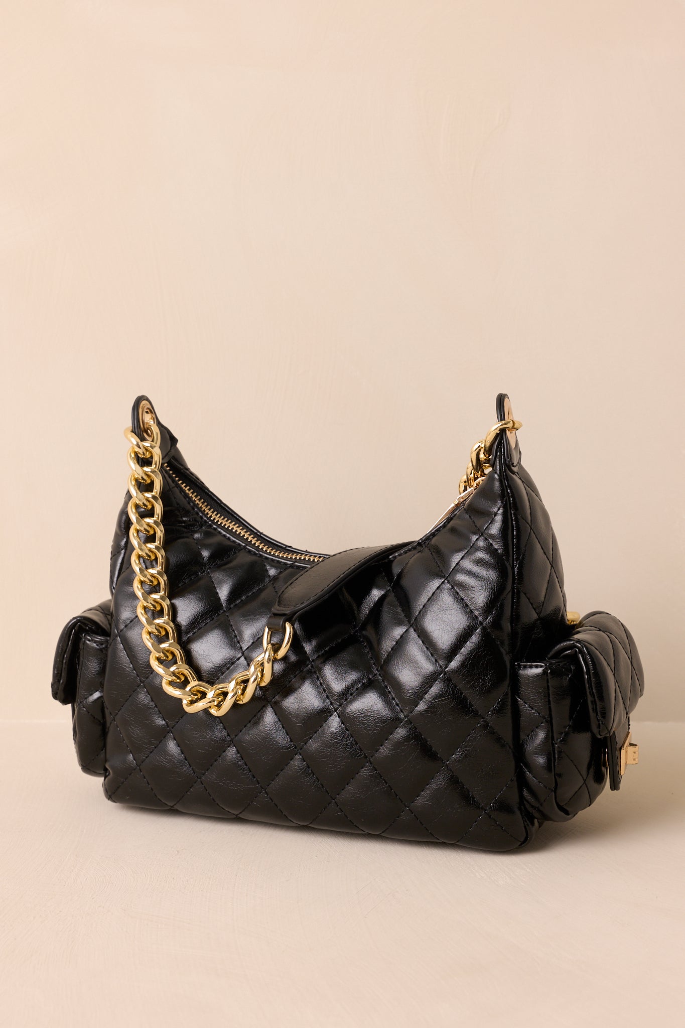 Black quilted crossbody bag with gold chain, Chanel Flap dupe